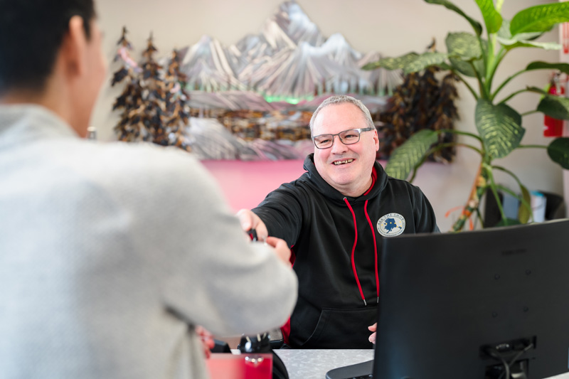 A and A The Shop Anchorage Service Advisor Welcoming Customer
